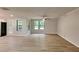 Open-concept living area featuring hardwood floors, recessed lighting, and lots of natural light at 5429 Martins Crossing Rd, Stone Mountain, GA 30088