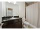 Bathroom featuring single sink vanity and shower-tub combination at 6294 Century Park Se Pl, Mableton, GA 30126