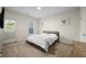 Bedroom featuring modern decor, natural light, and access to outdoor space at 6294 Century Park Se Pl, Mableton, GA 30126
