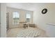 Bright bedroom with a desk near the windows, neutral walls, and carpet flooring at 6294 Century Park Se Pl, Mableton, GA 30126