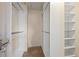 A walk-in closet with built-in shelving and ample space for storage at 6294 Century Park Se Pl, Mableton, GA 30126