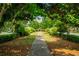 Beautifully landscaped walkway leading to residential buildings in a lush community at 6294 Century Park Se Pl, Mableton, GA 30126