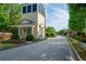 Community entrance featuring a gatehouse, brick-paved entry, and lush landscaping at 6294 Century Park Se Pl, Mableton, GA 30126