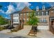 Charming brick townhome exterior with attached garage and well-manicured lawn at 6294 Century Park Se Pl, Mableton, GA 30126