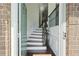 Welcoming foyer with hardwood floors, staircase, and elegant wainscoting at 6294 Century Park Se Pl, Mableton, GA 30126
