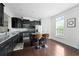 Modern kitchen featuring stainless steel appliances and a breakfast bar with seating at 6294 Century Park Se Pl, Mableton, GA 30126