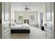Bright main bedroom with neutral tones, ceiling fan and ensuite access at 6294 Century Park Se Pl, Mableton, GA 30126