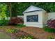 Legacy sign surrounded by flower beds, greenery, and mulch at 6294 Century Park Se Pl, Mableton, GA 30126
