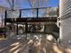 The covered outdoor patio offers an expansive area for entertainment and access to an upper-level deck at 6542 Cherry Tree Ln, Atlanta, GA 30328