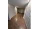 Finished basement area featuring tile flooring, recessed lighting, and multiple storage closets at 6542 Cherry Tree Ln, Atlanta, GA 30328