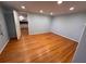 Bedroom featuring hardwood floors and open doorway to the kitchen at 6542 Cherry Tree Ln, Atlanta, GA 30328