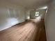 Bright bedroom with hardwood floors, closet, and plenty of natural light at 6542 Cherry Tree Ln, Atlanta, GA 30328