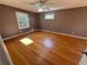 Bedroom with hardwood floors, two windows, and neutral-colored walls at 6542 Cherry Tree Ln, Atlanta, GA 30328