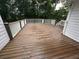 Spacious wooden deck featuring railings and stairs, perfect for outdoor enjoyment at 6542 Cherry Tree Ln, Atlanta, GA 30328