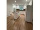 Spacious kitchen with stainless steel appliances, granite island, and hardwood floors at 6542 Cherry Tree Ln, Atlanta, GA 30328
