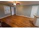 Kitchen adjacent to living room featuring hardwood floors and breakfast bar at 6542 Cherry Tree Ln, Atlanta, GA 30328