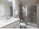 Clean bathroom features a white vanity, tiled shower with glass door, and neutral walls at 2048 Rockledge Ne Rd, Atlanta, GA 30324