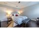 Bright bedroom features a tray ceiling, dark hardwood floors, and a comfortable queen-sized bed at 2048 Rockledge Ne Rd, Atlanta, GA 30324