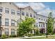 Attractive townhome exterior with a combination of brick and siding, complemented by mature landscaping at 2048 Rockledge Ne Rd, Atlanta, GA 30324