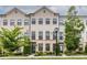 Inviting townhome exterior featuring a combination of stone and siding with a well-manicured lawn at 2048 Rockledge Ne Rd, Atlanta, GA 30324