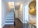 Elegant foyer with hardwood floors, staircase, leading to the upper levels of the home at 2048 Rockledge Ne Rd, Atlanta, GA 30324