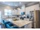 Bright kitchen with stainless steel appliances, granite counters, island, and modern cabinetry at 2048 Rockledge Ne Rd, Atlanta, GA 30324