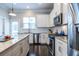 Well-equipped kitchen with modern stainless steel appliances, granite countertops and modern lighting at 2048 Rockledge Ne Rd, Atlanta, GA 30324