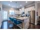 Bright kitchen with stainless steel appliances, granite counters, island, and hardwood floors at 2048 Rockledge Ne Rd, Atlanta, GA 30324