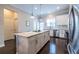 Open kitchen featuring an island with granite countertops and hardwood floors at 2048 Rockledge Ne Rd, Atlanta, GA 30324
