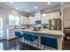Bright kitchen featuring an island with granite countertops, stainless appliances, and modern lighting at 2048 Rockledge Ne Rd, Atlanta, GA 30324
