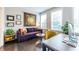 Cozy living room with hardwood floors, a comfortable couch, and bright windows offering natural light at 2048 Rockledge Ne Rd, Atlanta, GA 30324