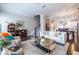 Open-concept living room with a comfortable couch, chic decor, and seamless flow to the dining and kitchen areas at 2048 Rockledge Ne Rd, Atlanta, GA 30324