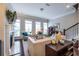 Spacious living room with large windows, a fireplace, comfortable seating, and dark hardwood floors at 2048 Rockledge Ne Rd, Atlanta, GA 30324