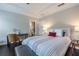 Comfortable bedroom featuring a tray ceiling, ensuite bathroom and neutral decor at 2048 Rockledge Ne Rd, Atlanta, GA 30324