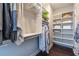 Organized walk-in closet provides ample shelving and hanging space for storing clothing and accessories at 2048 Rockledge Ne Rd, Atlanta, GA 30324
