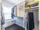 Bright walk-in closet with built-in shelving and hanging rods for organized storage at 2048 Rockledge Ne Rd, Atlanta, GA 30324