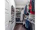 Organized walk-in closet featuring shelving and hanging storage for shoes, clothing, and accessories at 2048 Rockledge Ne Rd, Atlanta, GA 30324