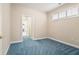 This bedroom with soft carpet, window with shutters and neutral walls awaits your personal touch at 2050 Woodberry Run Dr, Snellville, GA 30078