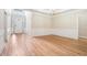 Open dining room with gleaming hardwood floors, chair rail, and detailed trim work, great for entertaining at 2050 Woodberry Run Dr, Snellville, GA 30078