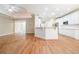 Modern kitchen with white cabinets, quartz countertops, stainless steel appliances, and a breakfast bar at 2050 Woodberry Run Dr, Snellville, GA 30078