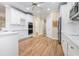 Well-appointed kitchen with sleek countertops, modern appliances, ample cabinetry, and seamless access to dining area at 2050 Woodberry Run Dr, Snellville, GA 30078