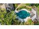 Aerial view of a private pool with lush landscaping and outdoor seating at 3086 E Pine Valley Nw Rd, Atlanta, GA 30305