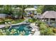 A private backyard oasis with pool, manicured landscaping, patio, and charming pool house at 3086 E Pine Valley Nw Rd, Atlanta, GA 30305