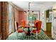 Charming dining room with hardwood floors, classic chandelier, and access to kitchen at 3086 E Pine Valley Nw Rd, Atlanta, GA 30305