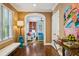 Inviting foyer with hardwood floors and stylish decor leads to the living room at 3086 E Pine Valley Nw Rd, Atlanta, GA 30305