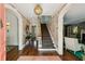 Inviting foyer with hardwood floors, staircase, elegant wallpaper, and decorative lighting at 3086 E Pine Valley Nw Rd, Atlanta, GA 30305
