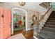 Grand foyer features hardwood floors, archways, staircase, and views into the dining room at 3086 E Pine Valley Nw Rd, Atlanta, GA 30305