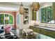 Kitchen with eat-in island, custom cabinets, stainless appliances, and view into the living room at 3086 E Pine Valley Nw Rd, Atlanta, GA 30305