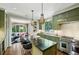 Bright kitchen features custom cabinets, an eat-in island, stainless appliances, and adjacent sitting area at 3086 E Pine Valley Nw Rd, Atlanta, GA 30305