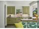 Outdoor kitchen with sage cabinets, marble countertops, and bar seating at 3086 E Pine Valley Nw Rd, Atlanta, GA 30305
